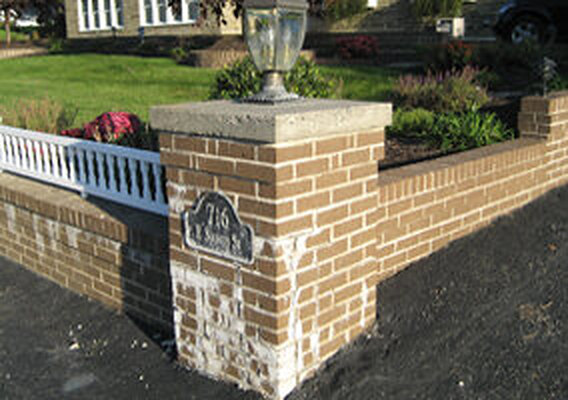 Deteriorated brick pillar before restoration