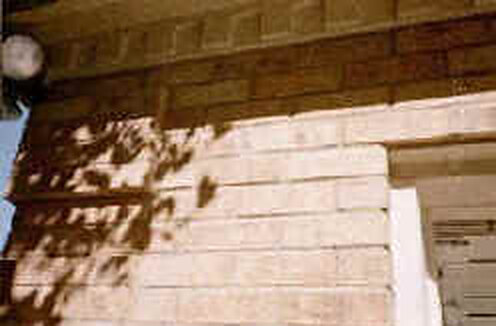 The wall repaired and repointed
