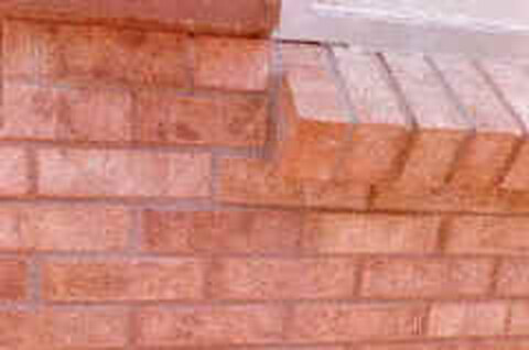 The corner rebuilt and repointed