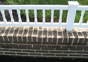 The garden wall rebuilt and capped