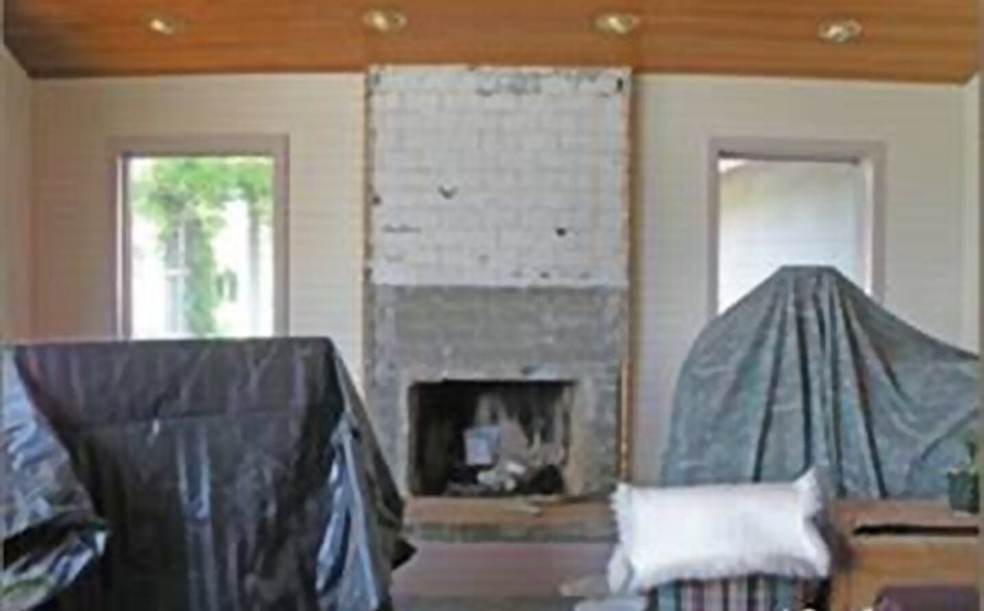 Before: fireplace mid-renovation, stripped to the block