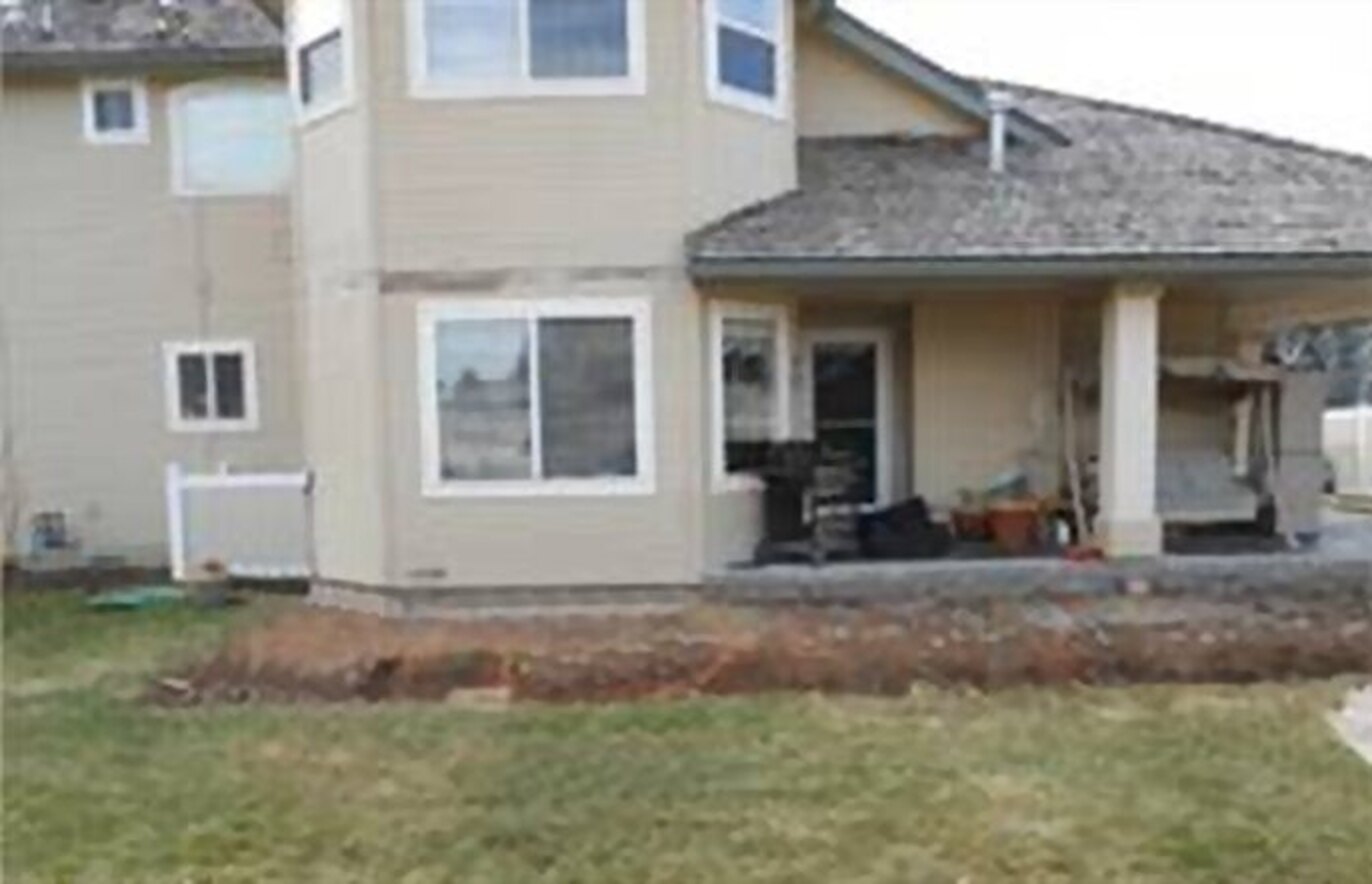 Before: bare backyard ahead of patio build