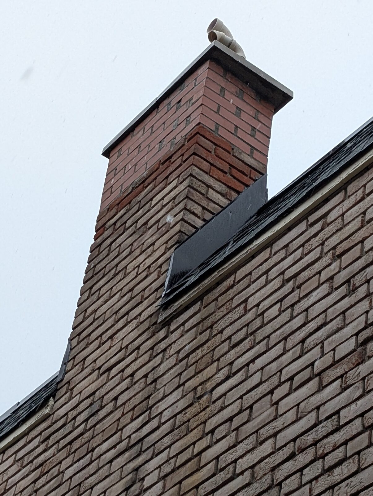 Partial chimney rebuild on a century home in The Junction