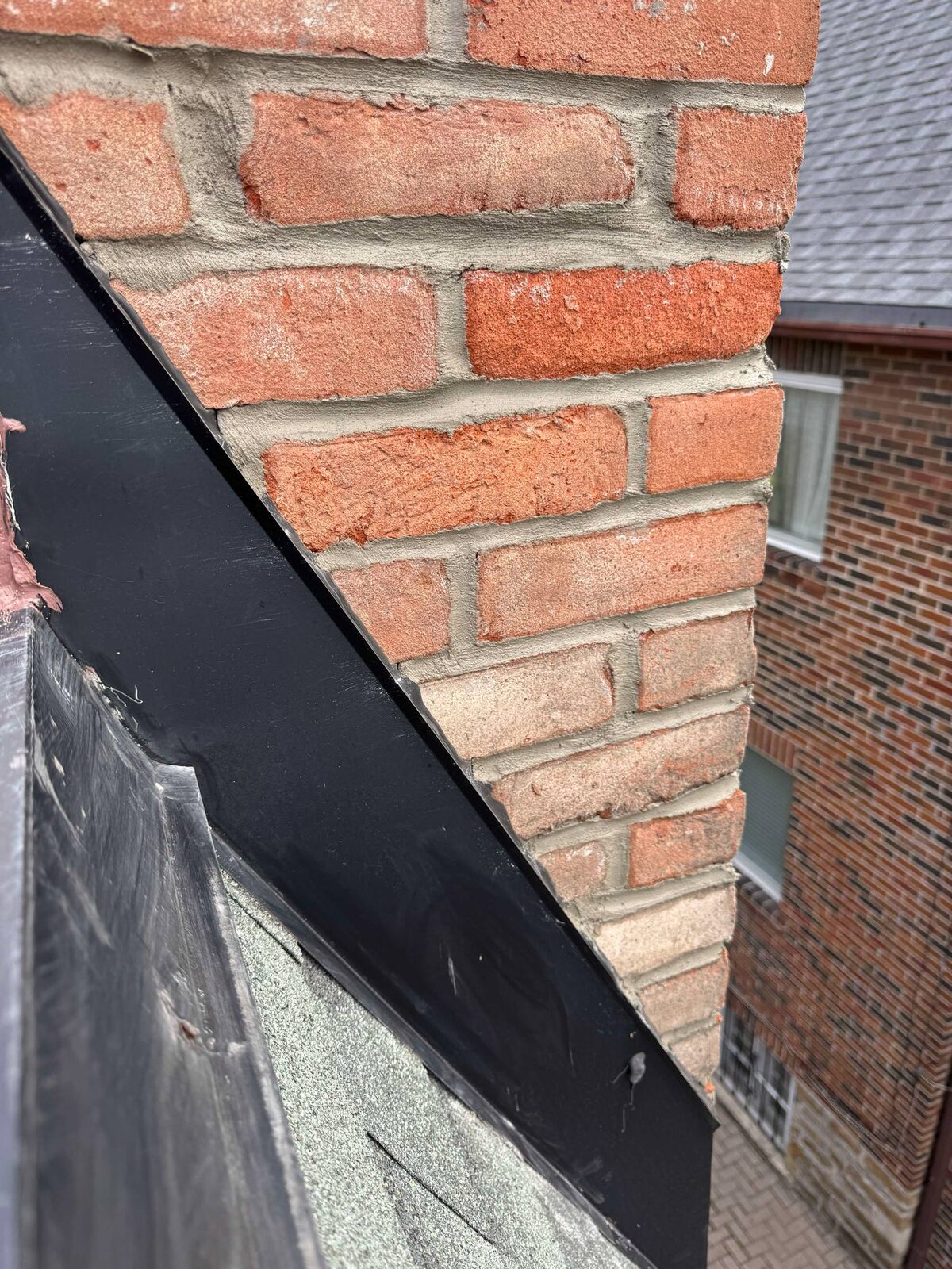 New flashing detail where chimney meets the roof