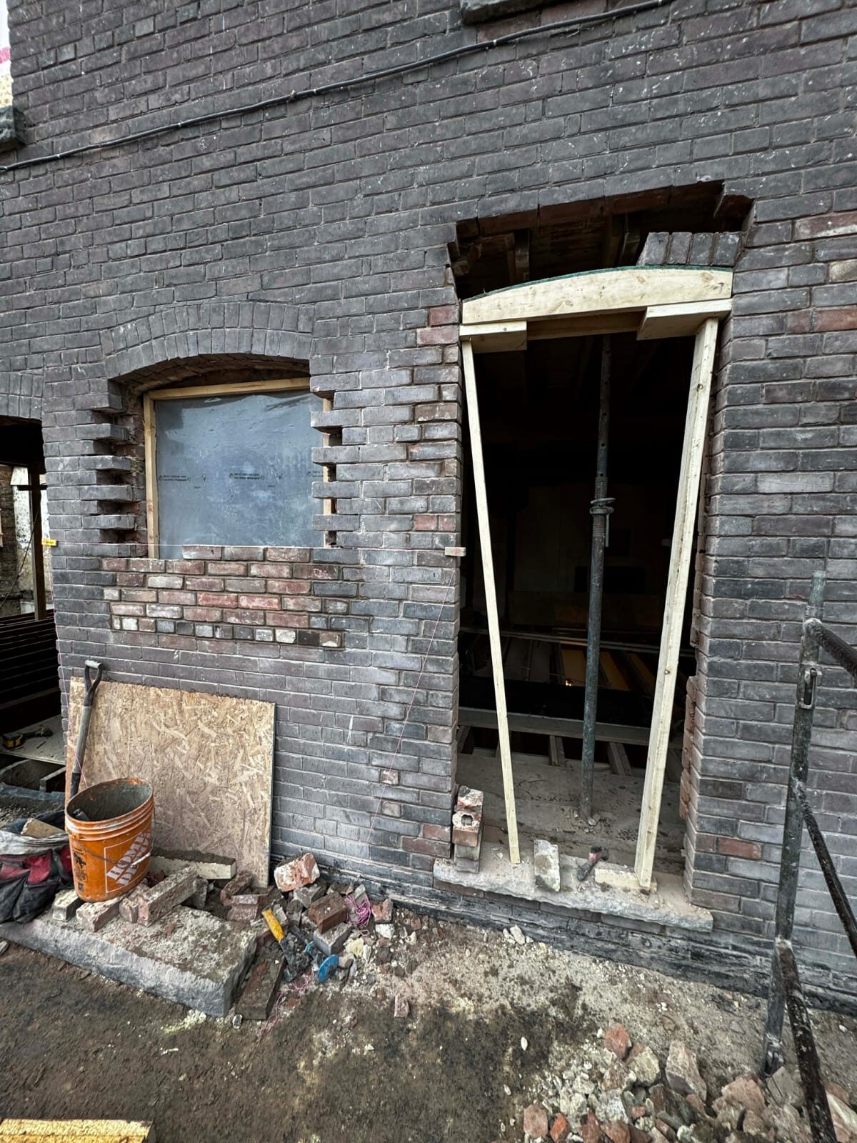 New window opening cut into an existing brick wall