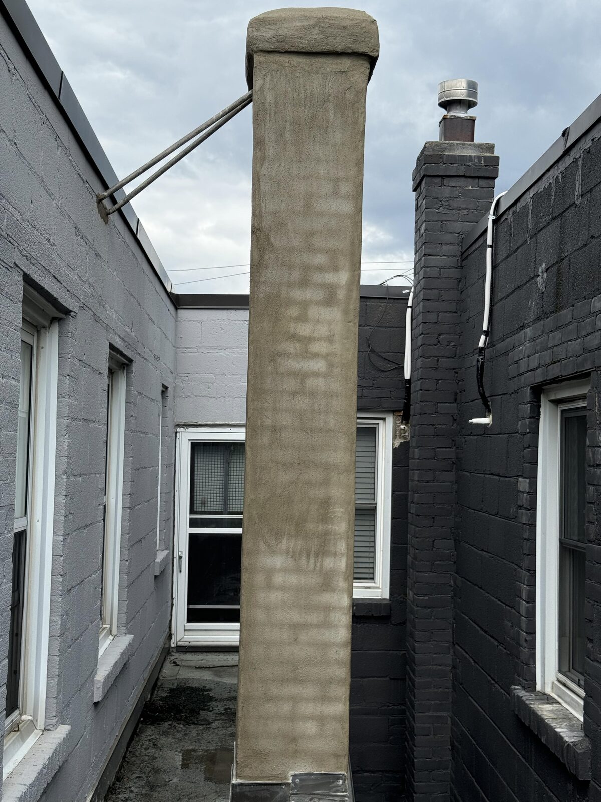 Tall parged commercial chimney