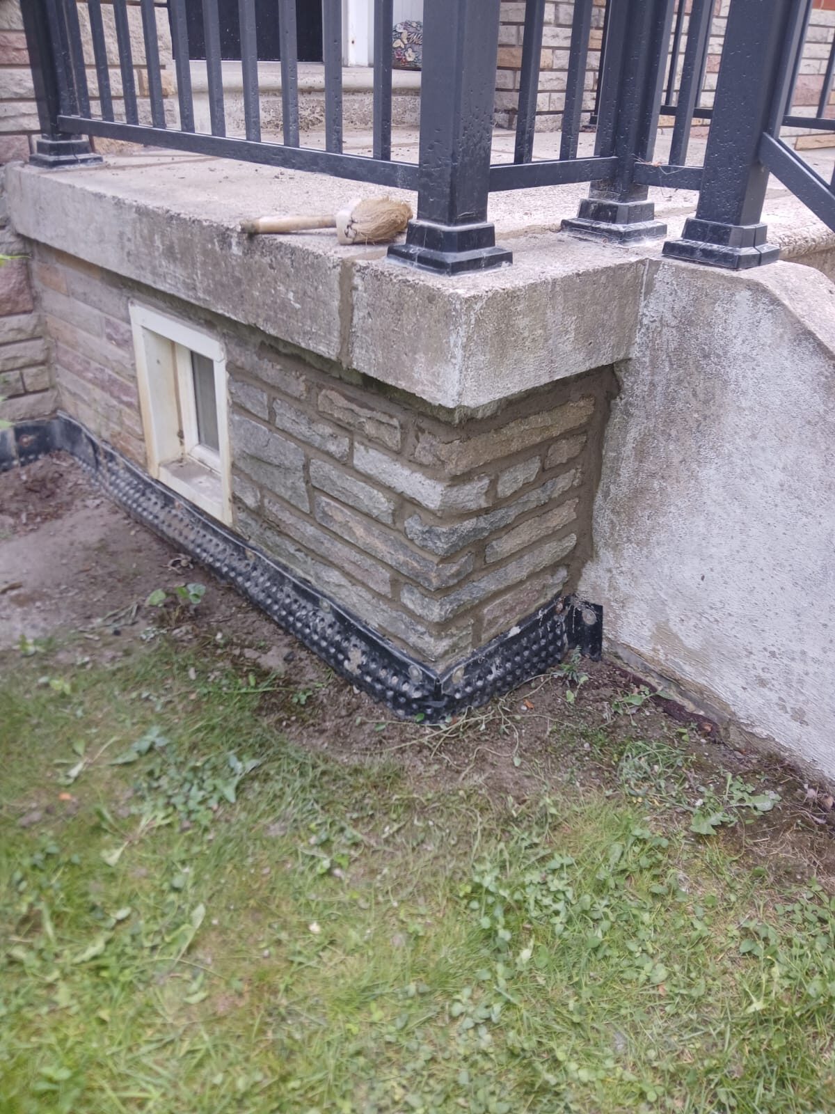 Stone porch foundation with new cap