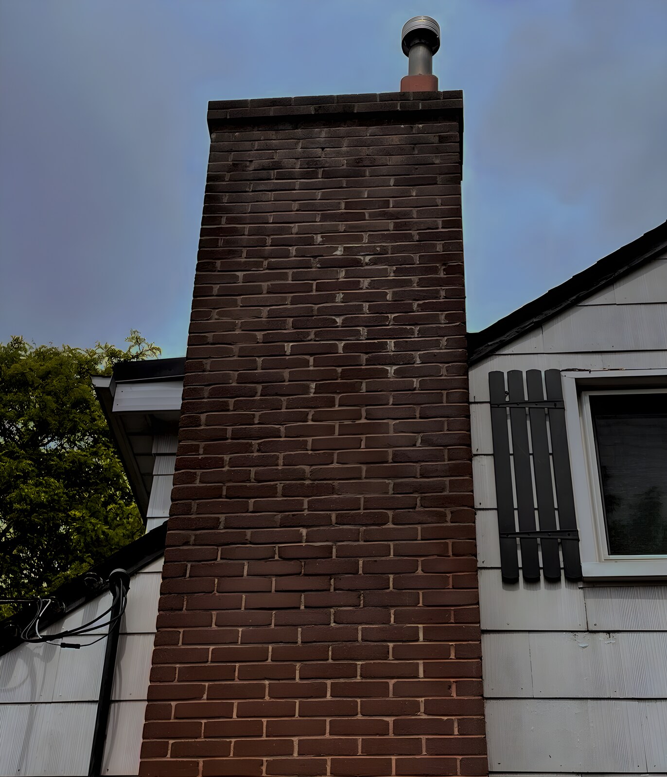 Brick chimney against a Toronto sky